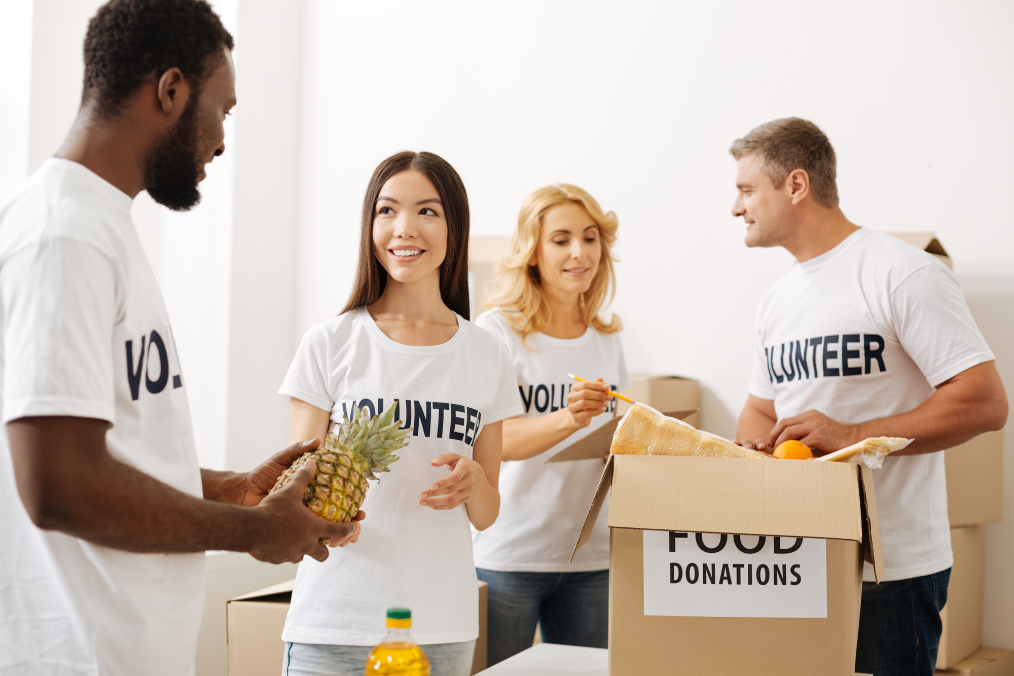 Volunteer group gathers around boxes